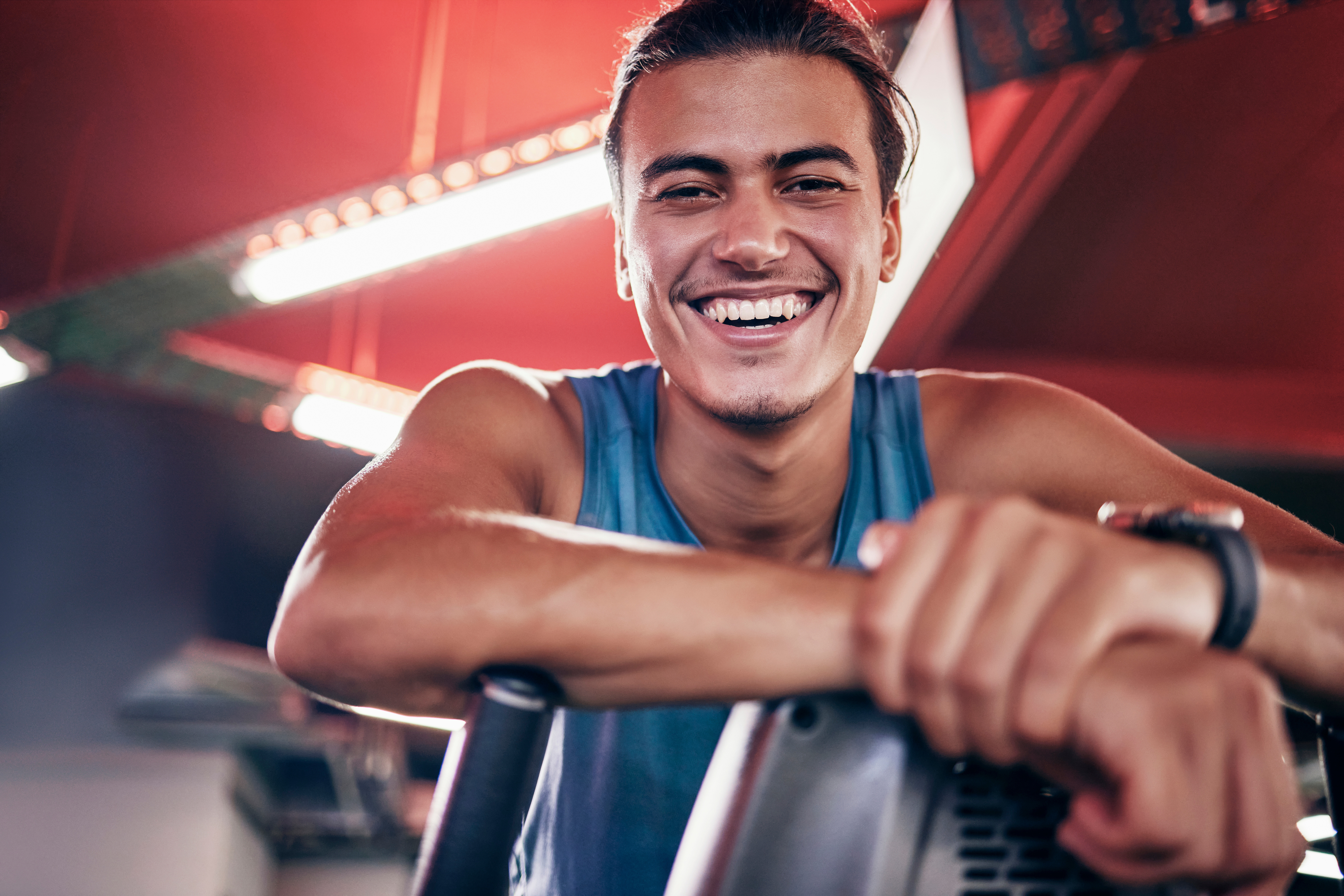Fitness, smile and portrait of man in gym, happiness in workout exercise with equipment in studio.
